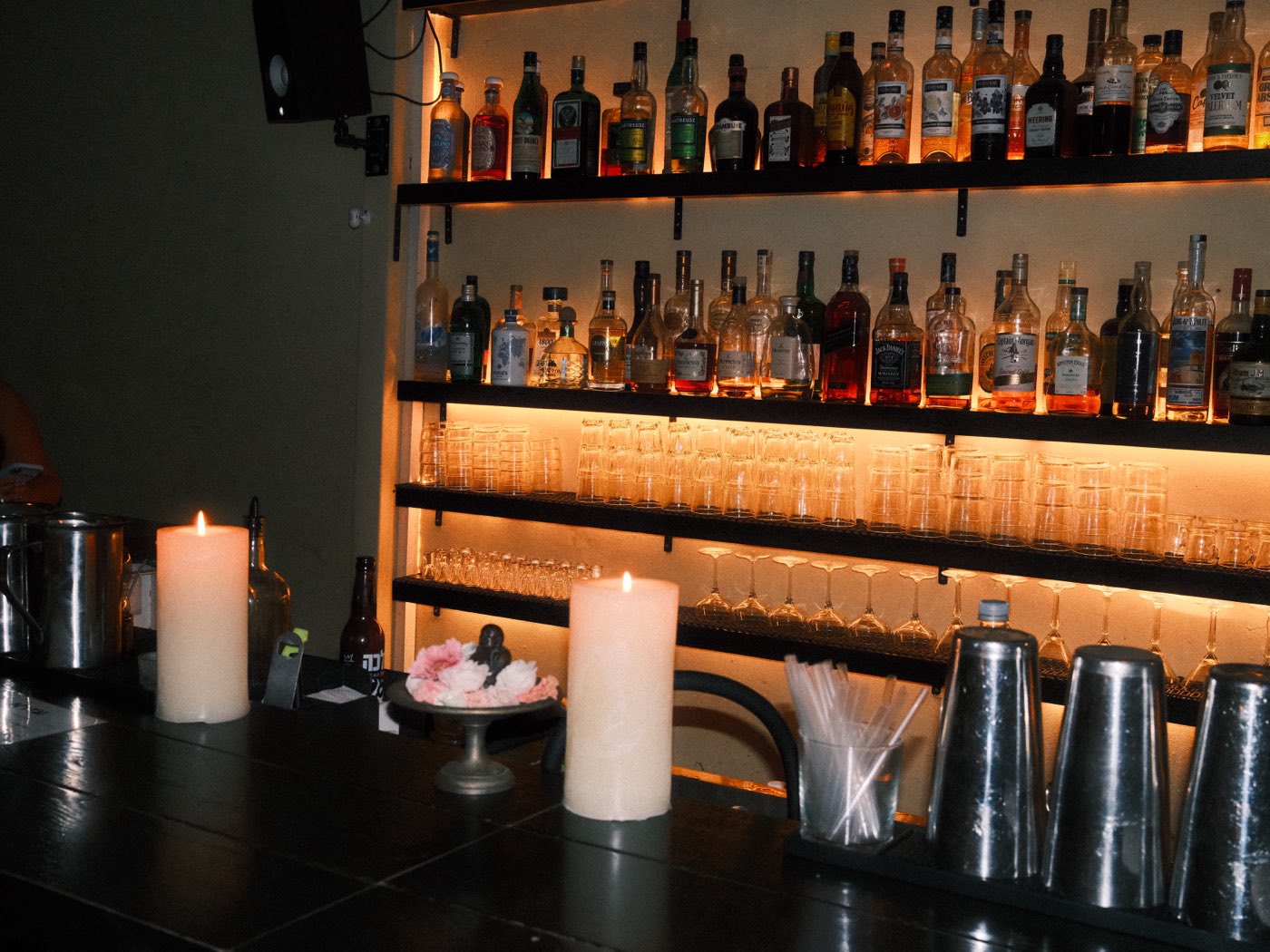 The bar at Ezra before the guests arrive, candles and glasses ready